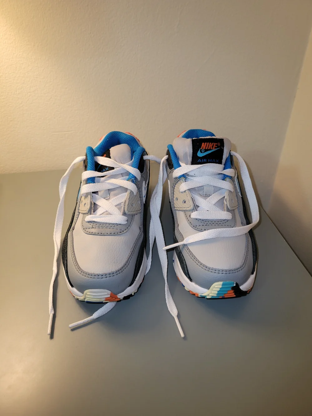 Nike AirMax90 Kids White and Gray Sneakers with Blue and Orange Accents